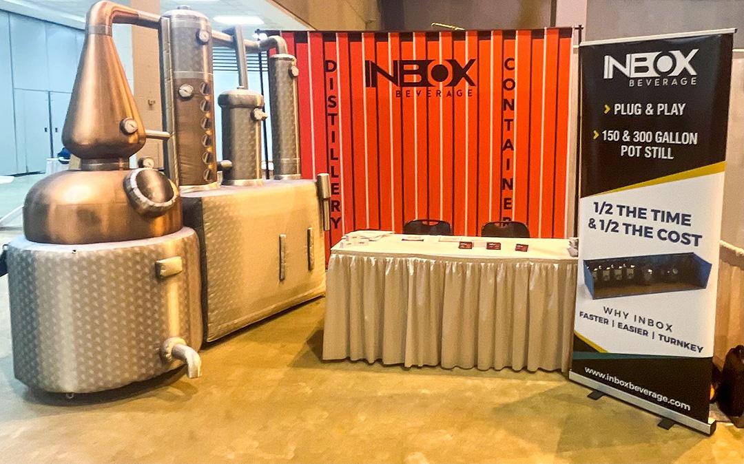Inflatable Fermentation Display Inbox Beverage Distillery's custom inflatable fermentation display in booth space