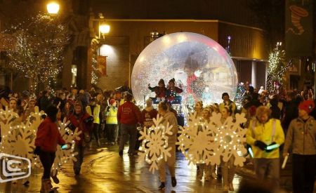 Inflatable Snowglobe with People Inside on Parade Float