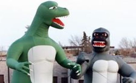 1980s inflatable gorilla and dinosaur outdoors
